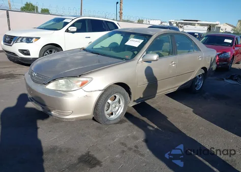 2002 Toyota Camry Le z USA, uszkodzony, nr VIN JTDBE32K120127837